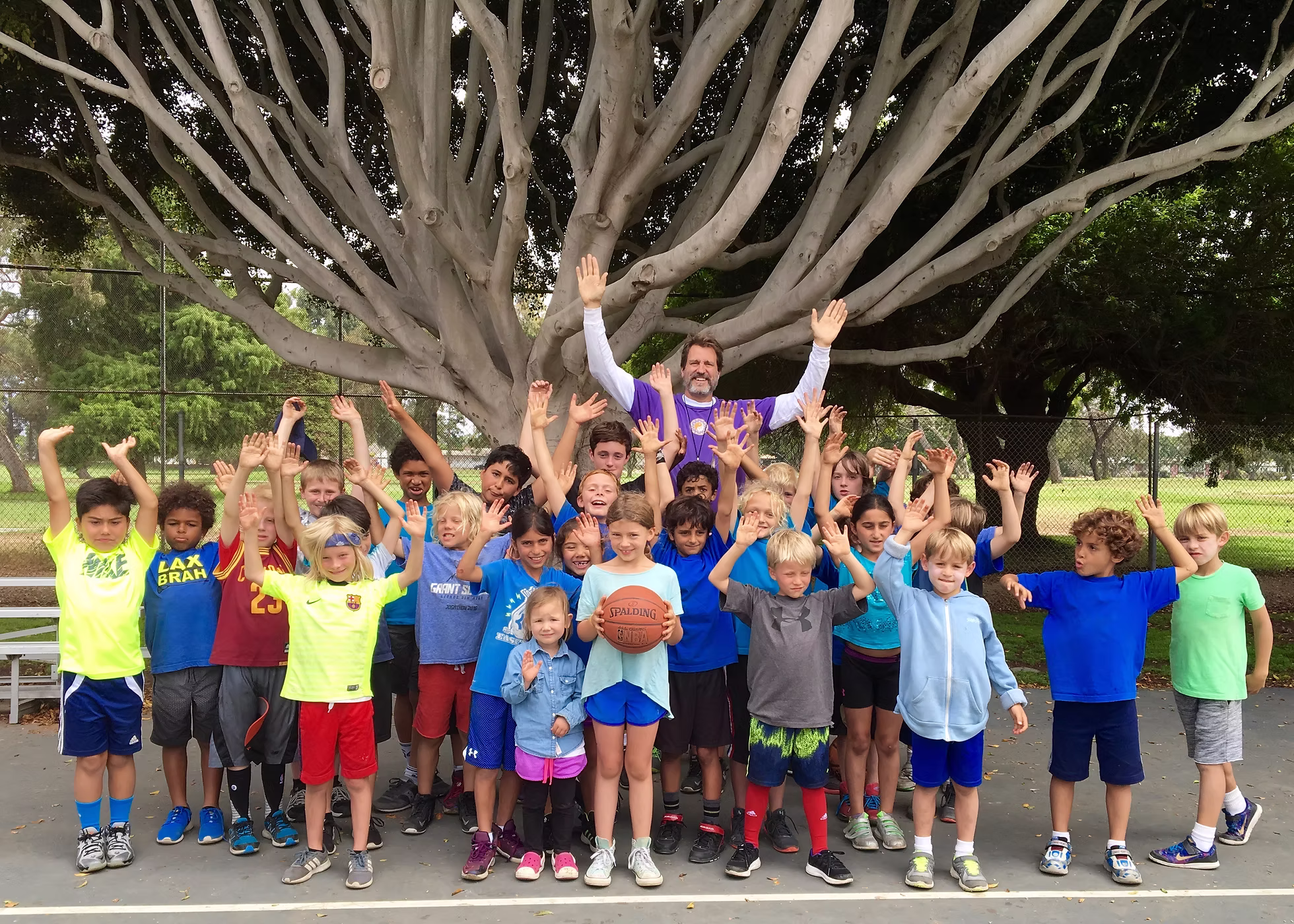 Coach Dave with full camp group under the tree